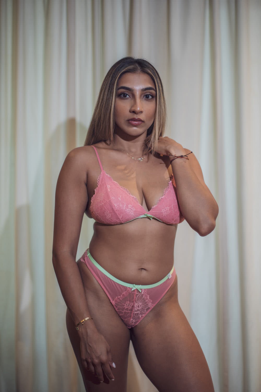 Model in the Holiday Edition Hayden Bralette and Brief in Coral and Mint - Front